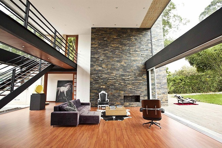 Stone Wall Olaya Attractive Stone Wall In The Olaya House David Ramirez Lounge With Wide Fireplace And Purple Sofa Chaise Decoration Fascinating And Modern Living Space Design: The Olay House