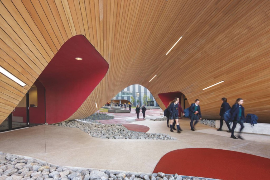 Design Of Centre Rounded Design Of PEGS Infinity Centre By McBride Charles Ryan Architects That Is Designed With The Red Color Of The Entry Gate Of The Building Architecture Luxurious School In Unique And Fantastic Design Style