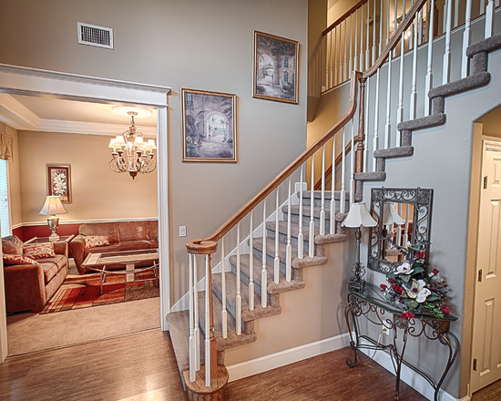 Style Indoor Steps Vintage Style Indoor Staircase With Steps Covered With Carpet Decorated With Framed Photos Attached On Wall Architecture Simple Natural Home With Futuristic Architecture Decoration