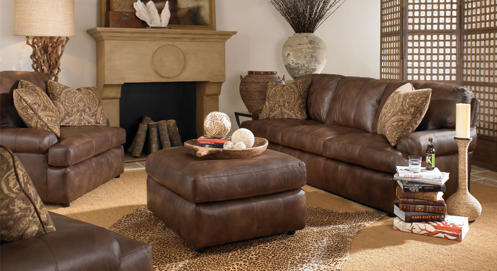 Leopard Skin Brown Beautiful Leopard Skin Rug Also Brown Leather Sofa And Square Ottoman Table Plus Wood Fireplace Insert In Rustic Living Room Living Room Rustic Living Room Appears Fantastic Performance