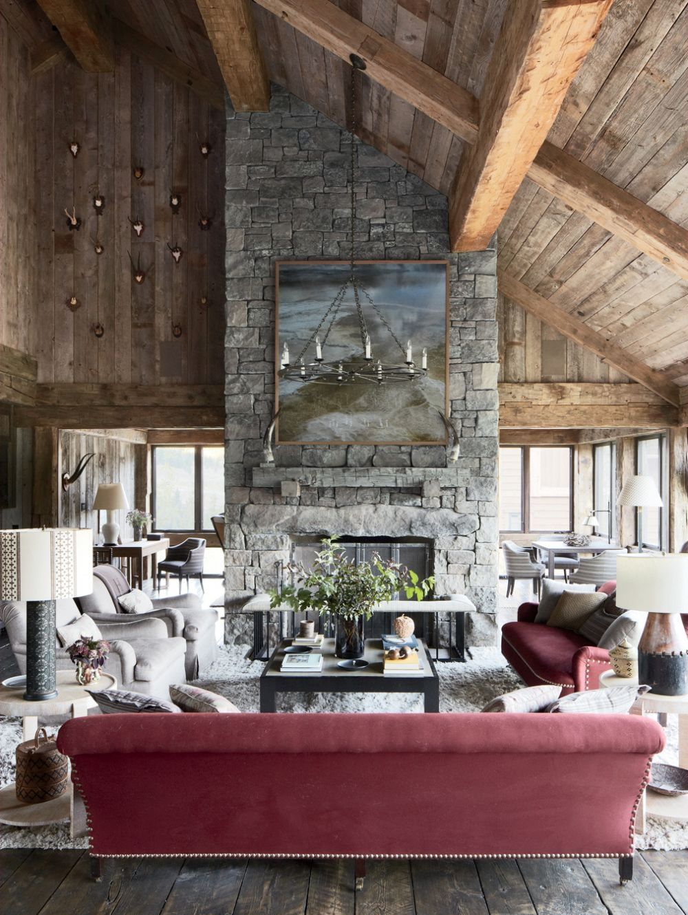 Red Sofa Fireplace Pretty Red Sofa Also Stone Fireplace And Exposed Wood Beam Feat Round Chandelier In Rustic Living Room  Living Room Rustic Living Room Appears Fantastic Performance